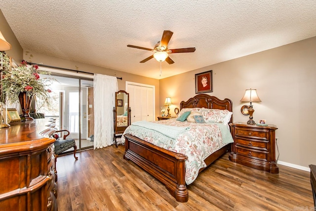 bedroom featuring a closet, a textured ceiling, dark hardwood / wood-style floors, and ceiling fan