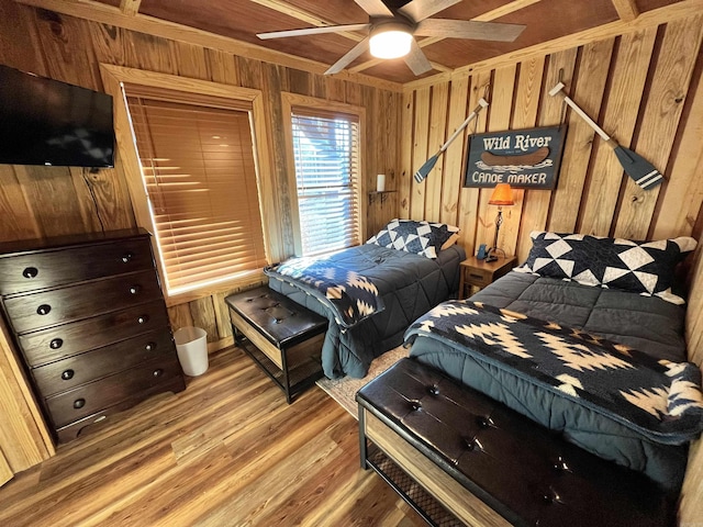 173 Henry Ln, Shirley, AR 72153 - bedroom featuring wood walls, light wood finished floors, and a ceiling fan