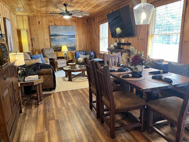 173 Henry Ln, Shirley, AR 72153 - dining room with wooden walls, wood ceiling, wood finished floors, and ceiling fan