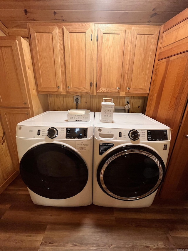 173 Henry Ln, Shirley, AR 72153 - laundry room with cabinet space, washer and clothes dryer, and wood finished floors