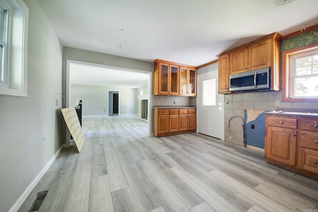 kitchen featuring backsplash and light hardwood / wood-style floors