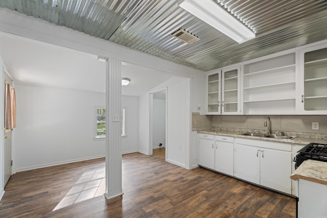 kitchen featuring white cabinetry, sink, and dark wood-type flooring