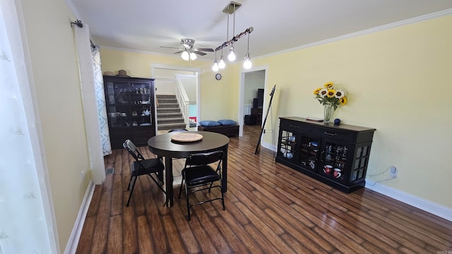 dining area featuring crown molding, ceiling fan, and dark hardwood / wood-style flooring