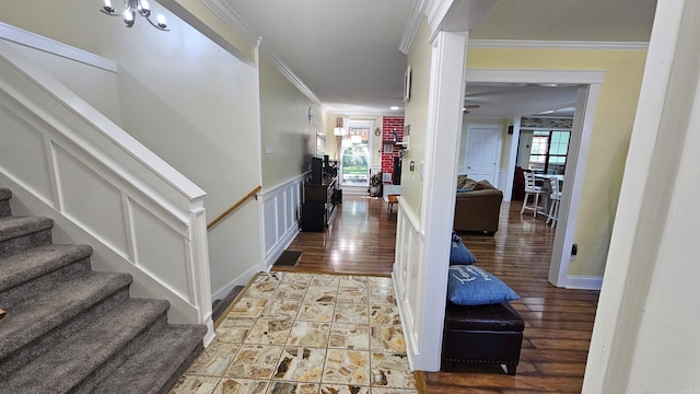 hall with crown molding and wood-type flooring