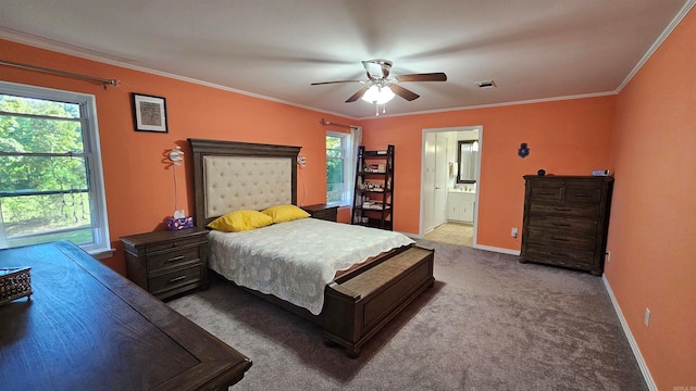 bedroom featuring ensuite bathroom, ornamental molding, light carpet, and ceiling fan