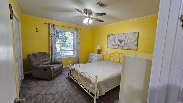 bedroom with crown molding, a closet, ceiling fan, and dark colored carpet