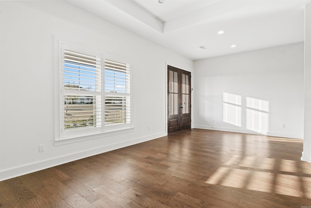 unfurnished room featuring dark hardwood / wood-style floors and french doors