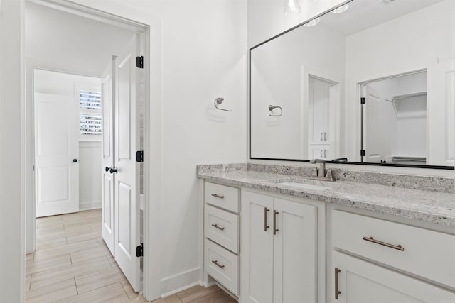 bathroom featuring vanity and wood-type flooring