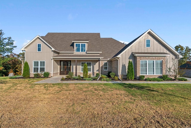 craftsman inspired home with a front yard