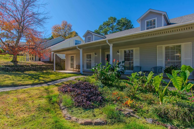 view of front facade with a front lawn and a porch