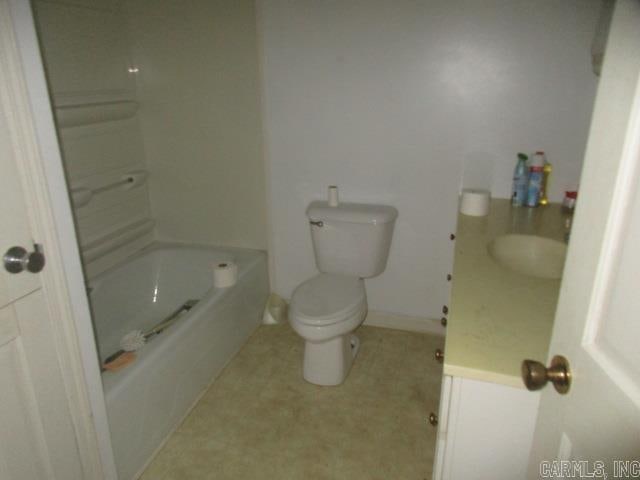 full bathroom with vanity, toilet, and washtub / shower combination