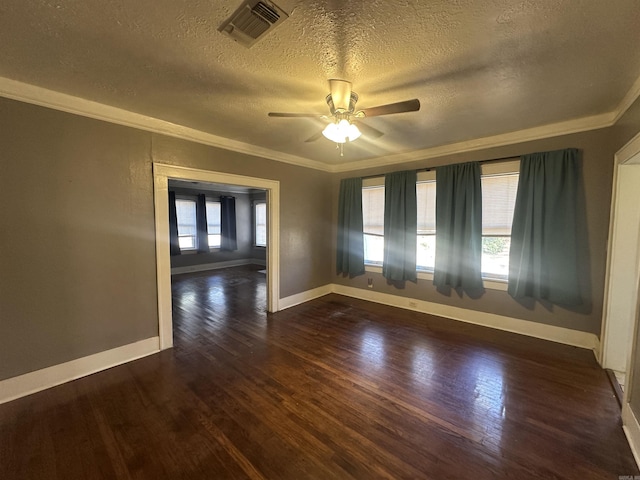 empty room featuring crown molding, dark hardwood / wood-style flooring, ceiling fan, and a textured ceiling