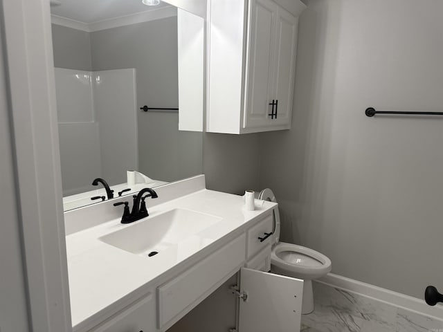 bathroom with toilet, vanity, baseboards, marble finish floor, and ornamental molding