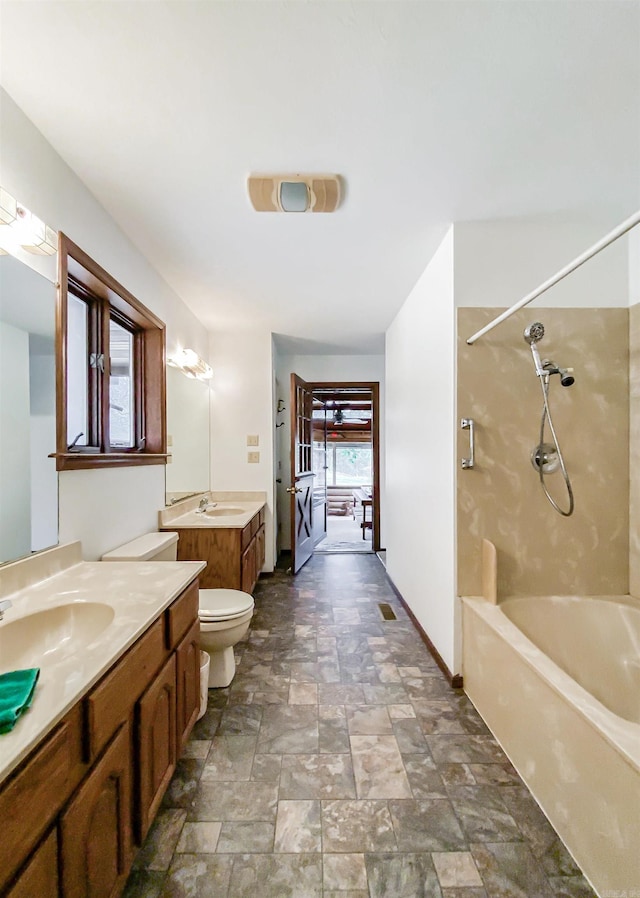 full bathroom with shower / bathing tub combination, vanity, and toilet