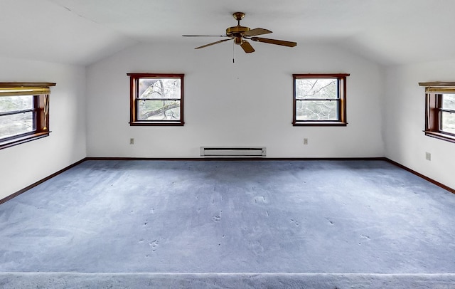 bonus room featuring baseboard heating, a wealth of natural light, and vaulted ceiling