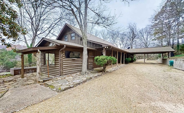 view of side of property with a carport