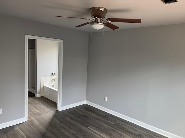 unfurnished bedroom with connected bathroom, ceiling fan, and dark hardwood / wood-style floors