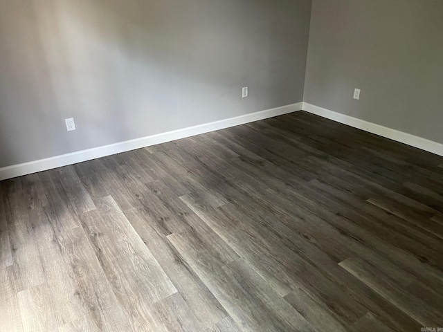 spare room with wood-type flooring