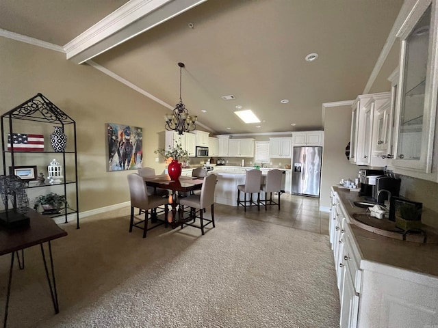 dining area with crown molding, carpet floors, lofted ceiling with beams, and an inviting chandelier