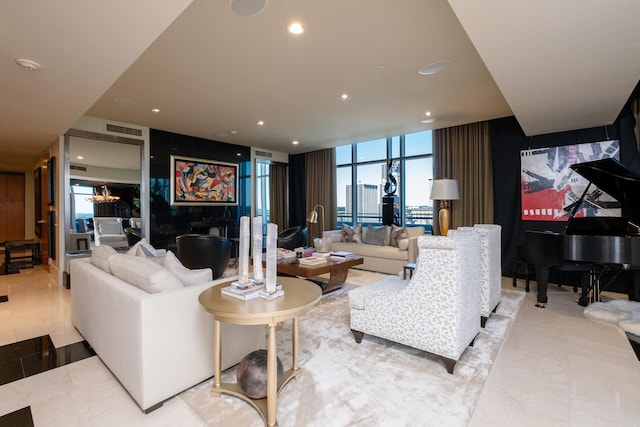 tiled living room featuring floor to ceiling windows