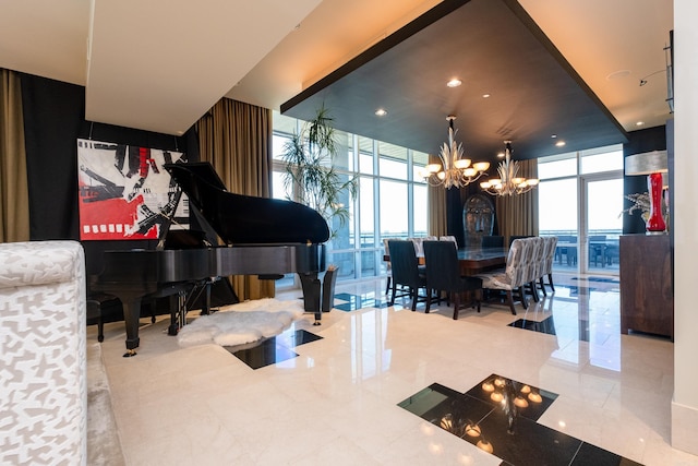 interior space with a wealth of natural light, an inviting chandelier, light tile patterned flooring, and a wall of windows