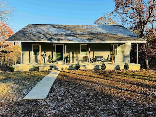 rear view of property with a porch