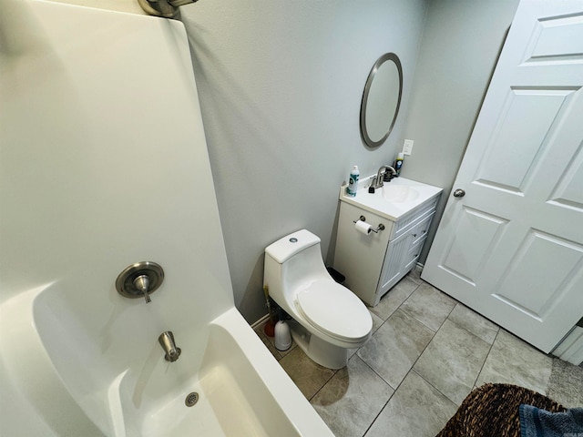 bathroom with tile patterned flooring, vanity, and toilet