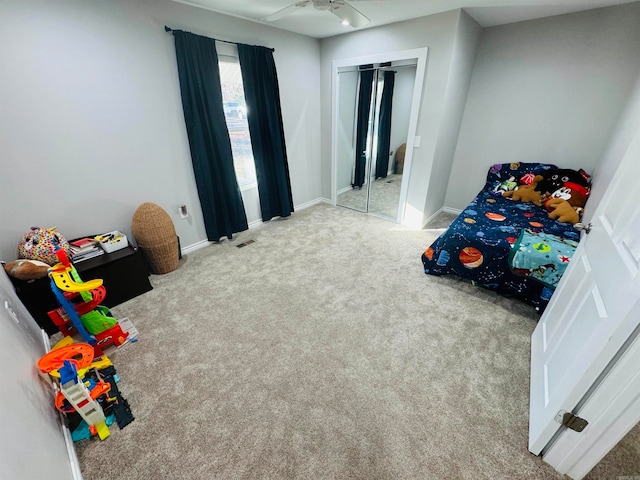 bedroom featuring carpet, a closet, and ceiling fan