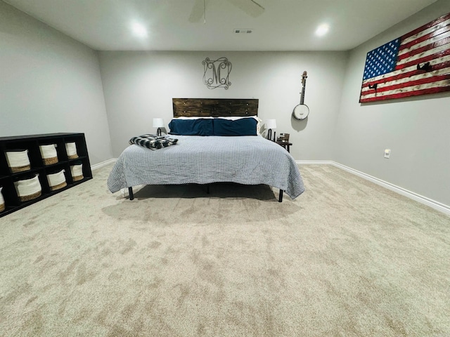 bedroom featuring ceiling fan and light carpet