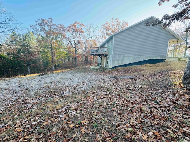 view of property exterior featuring a deck