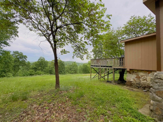 view of yard with a wooden deck