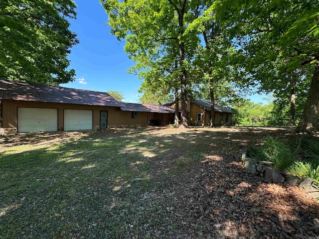 view of yard with a garage