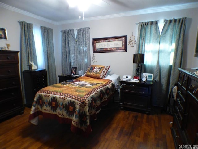 bedroom with multiple windows, dark hardwood / wood-style floors, ceiling fan, and crown molding