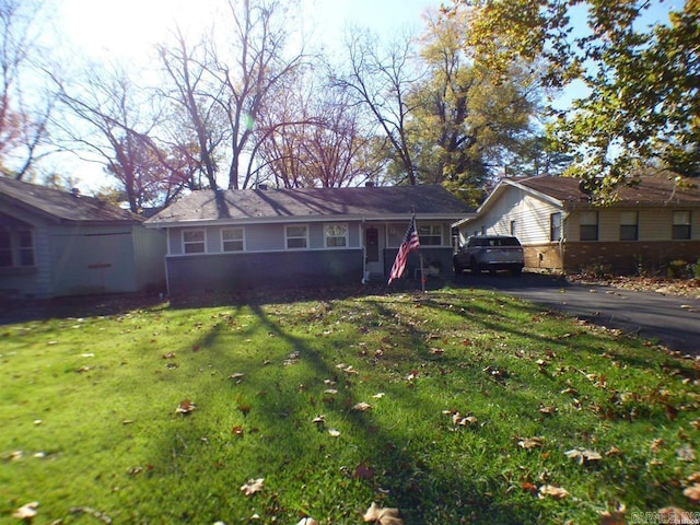 ranch-style house with a front lawn