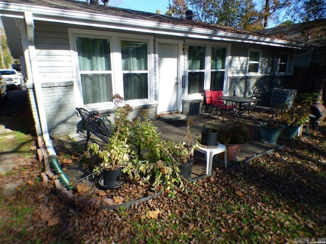 rear view of property featuring a patio area