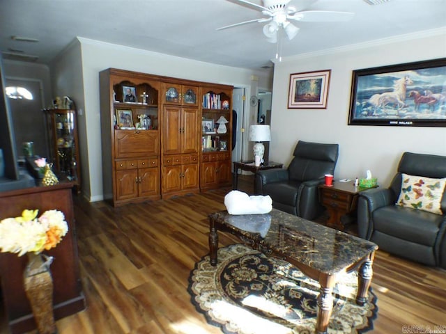 living room featuring ceiling fan, dark wood-type flooring, and ornamental molding