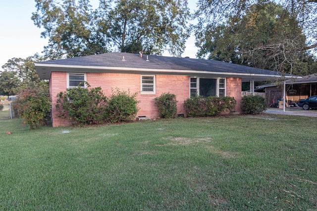 exterior space featuring a front yard and a carport