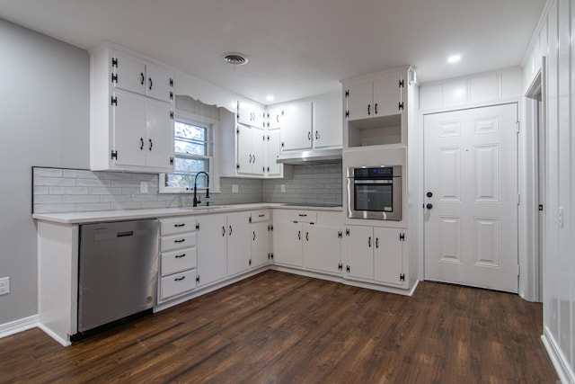 kitchen with white cabinets, stainless steel appliances, dark hardwood / wood-style floors, and sink