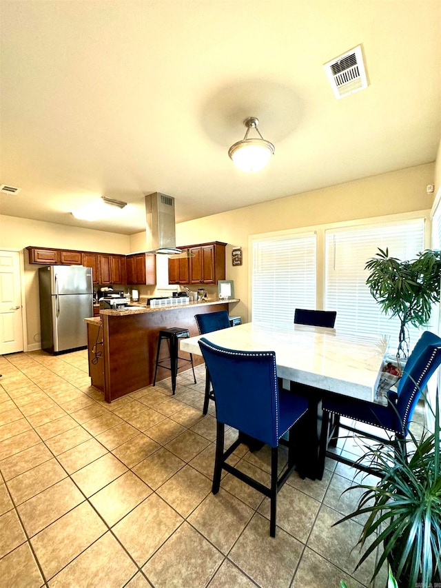 dining space with light tile patterned floors