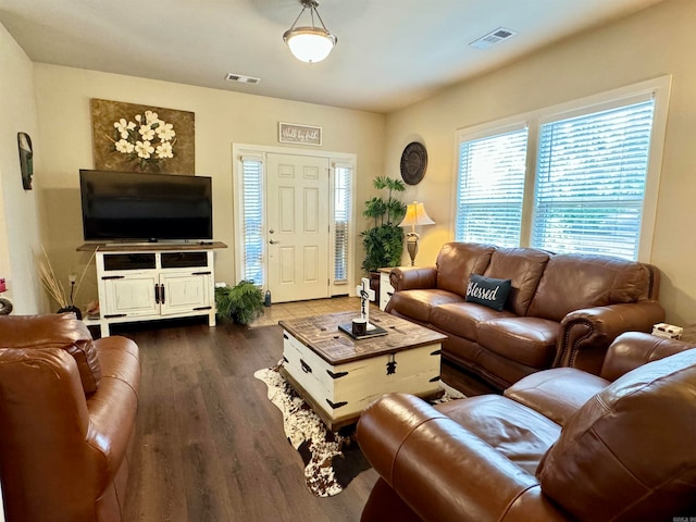 living room with dark hardwood / wood-style floors