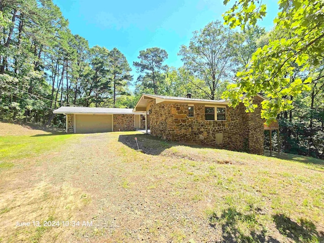 exterior space with a front lawn and a garage