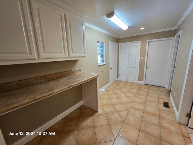 interior space featuring light tile patterned flooring and ornamental molding