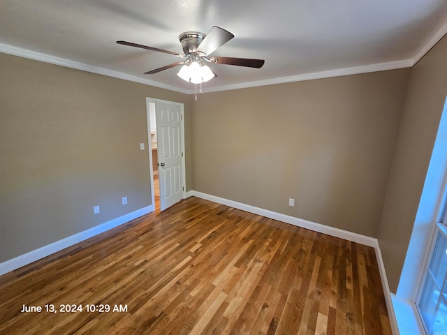 spare room featuring crown molding, ceiling fan, and hardwood / wood-style flooring