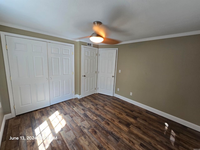 unfurnished bedroom featuring ceiling fan, dark hardwood / wood-style flooring, and crown molding