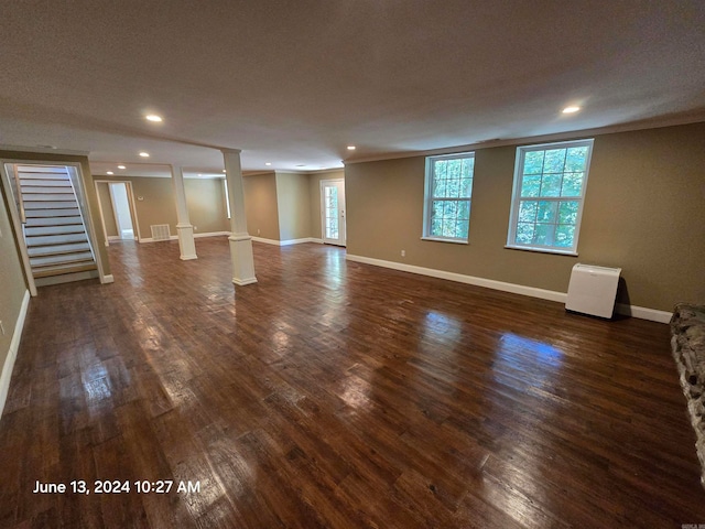 interior space with dark hardwood / wood-style flooring and a textured ceiling