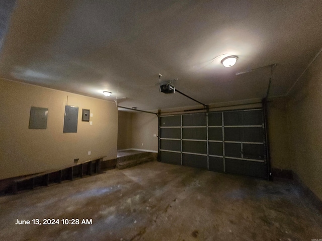 garage featuring a garage door opener and electric panel