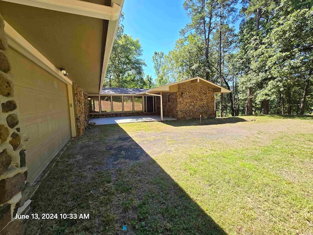 view of yard with a garage