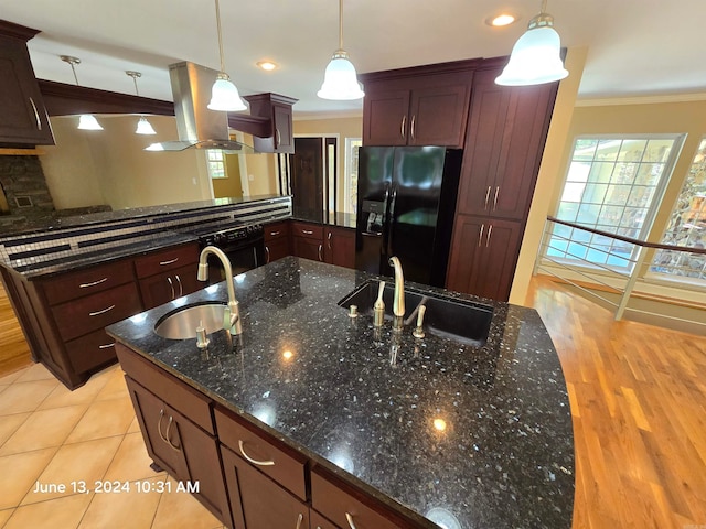 kitchen featuring island range hood, hanging light fixtures, black appliances, and sink