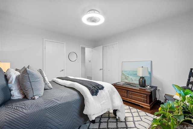 bedroom with hardwood / wood-style floors