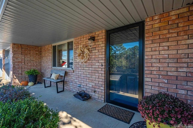 doorway to property featuring a porch